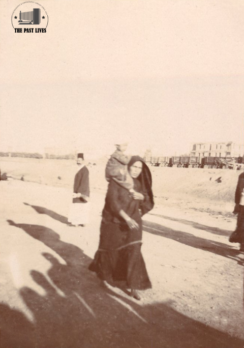 1900 Egypt, Alexandria, Woman carrying her child